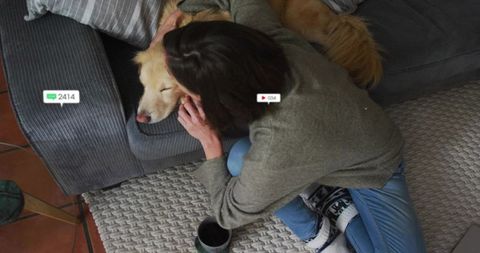 Serene Moment: Woman and Dog Enjoy Relaxing Bond at Home