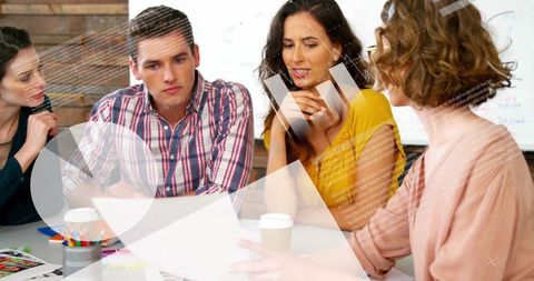 Creative Collaboration in Modern Office with Data Overlay