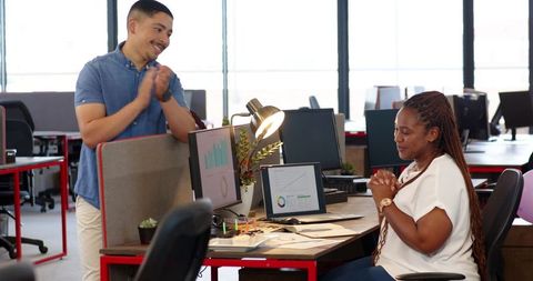 Office Birthday Celebration with Cake Between Coworkers