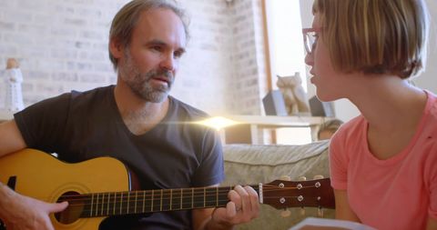 Father and Daughter Bond Through Music and Guitar Playing