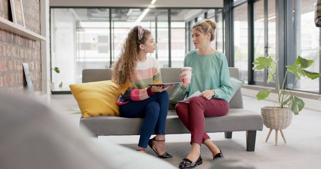 Young Women Collaborating in Modern Office Lounge Area - Download Free Stock Images Pikwizard.com