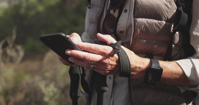 Outdoor Adventurer Using Smartphone for Navigation - Download Free Stock Images Pikwizard.com