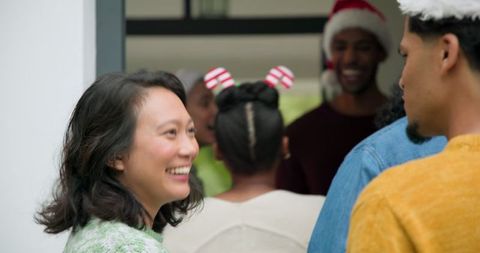 Diverse friends gathering outdoors holiday cheer together