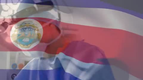 Dentist Using Microscope with Costa Rican Flag Overlay for Precision Examination