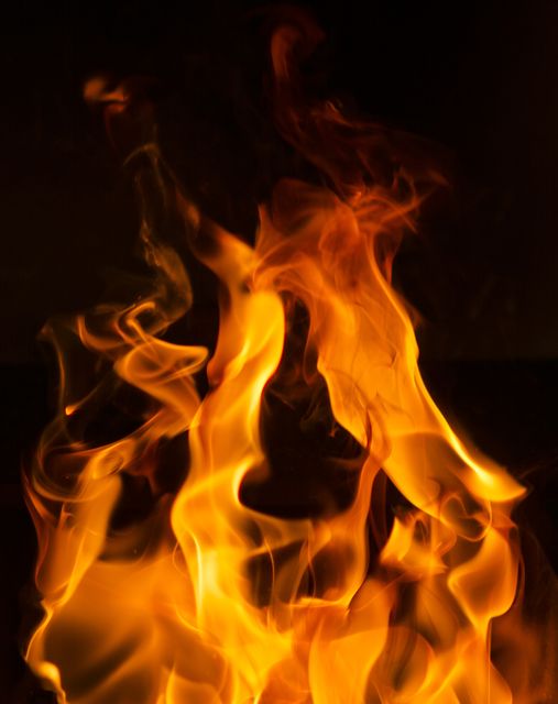 Vibrant Flames Burning in Dark Background - Download Free Stock Photos Pikwizard.com