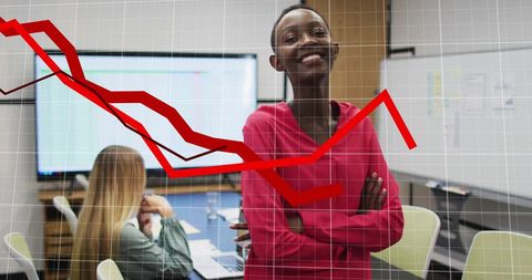 Confident businesswoman with declining graph in office