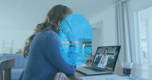 Woman in home office engaged in video call on laptop, with futuristic fingerprint overlay on screen representing biometric security. Useful for technology, remote work, cybersecurity, and identity verification themes.