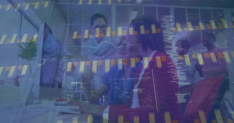 Business Team Collaborating Over Financial Analytics in Modern Office