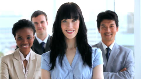 Diverse Business Team Smiling in Office Environment