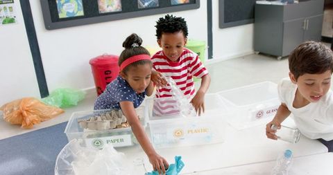 Children Recycling in Classroom Focused on Environmental Education - Download Free Stock Images Pikwizard.com