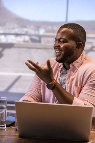 Businessman Engaging in Discussion at Workspace