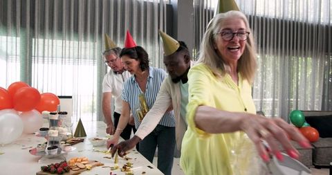 Cheerful colleagues celebrating office party together