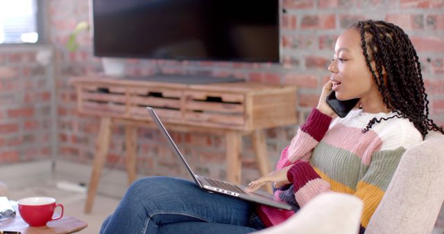 Young Woman Working from Home on Laptop While on Phone - Download Free Stock Images Pikwizard.com