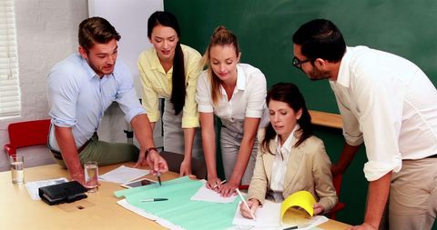 Diverse Business Team Collaborating on Project in Office Meeting - Download Free Stock Images Pikwizard.com