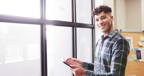 Designer Collaborating in Modern Office with Digital Tablet