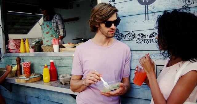 Friends at Food Truck Enjoying Street Food on a Sunny Day - Download Free Stock Images Pikwizard.com