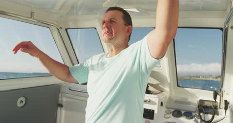 Man Walking in Boat Steering Room on Sunny Day