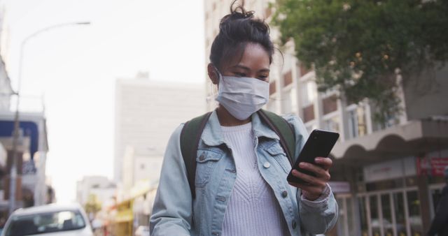 Young Woman Wearing Mask Using Smartphone Outdoors - Download Free Stock Images Pikwizard.com