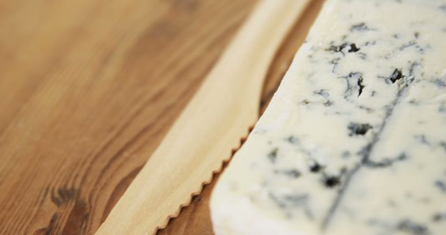 Close-Up of Blue Cheese and Wooden Cheese Knife - Download Free Stock Images Pikwizard.com