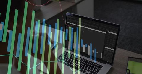 Female hand hovering over laptop trackpad analyzing dashboard with green bar chart overlay