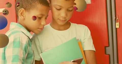 Children with Smartphone Surrounded by Emoji Icons in School
