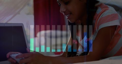 Young Woman Engaging with Digital Technology Using Smartphone and Laptop