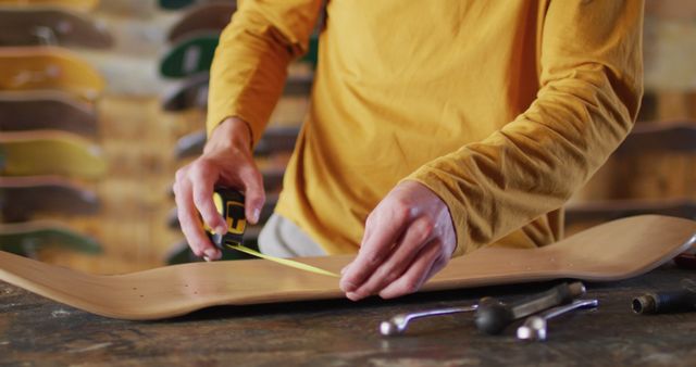 Craftsman Measuring Skateboard Deck with Tape Measure - Download Free Stock Images Pikwizard.com