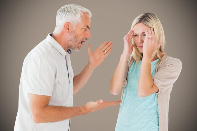 Digital composite of Senior man arguing with woman against gray background
