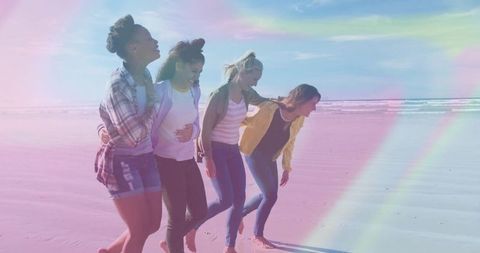 Friends Walking Together on Tranquil Beach