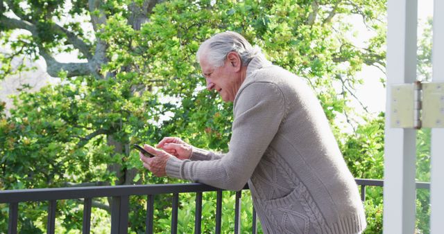 Elderly Man Using Smartphone on Balcony - Download Free Stock Images Pikwizard.com