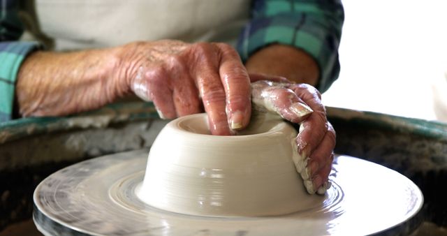 Craftsman Molding Clay on Pottery Wheel - Download Free Stock Images Pikwizard.com