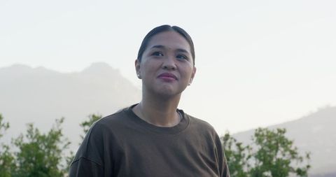 Woman Enjoying Serenity in Beautiful Scenic Overlook