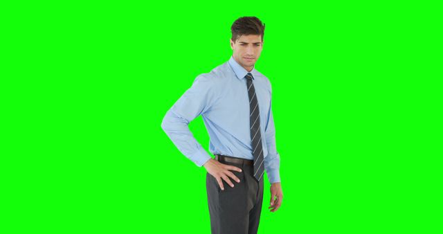 Confident Businessman in Professional Attire Posing with Hand on Hip - Download Free Stock Images Pikwizard.com