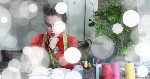 Fashion designer sketching in creative studio space