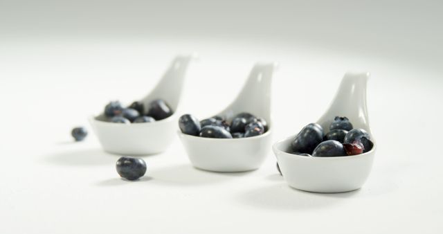 Fresh Blueberries in White Ceramic Spoons Simple Presentation - Download Free Stock Images Pikwizard.com