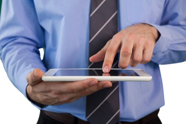 Mid section of businessman using tablet - Download Free Stock Photos Pikwizard.com