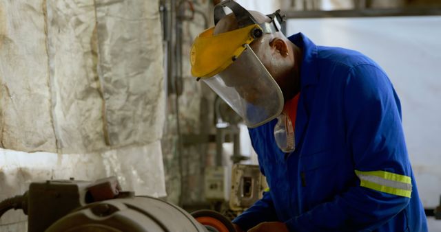 Factory Worker Wearing Safety Gear Operating Industrial Machinery - Download Free Stock Images Pikwizard.com