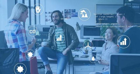 Creative team collaborating in modern open plan office with data overlays and eco metrics