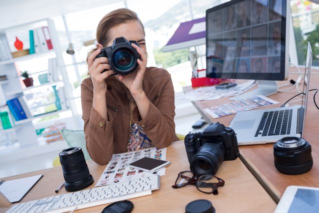 Female Photographer Working in Modern Office - Download Free Stock Photos Pikwizard.com