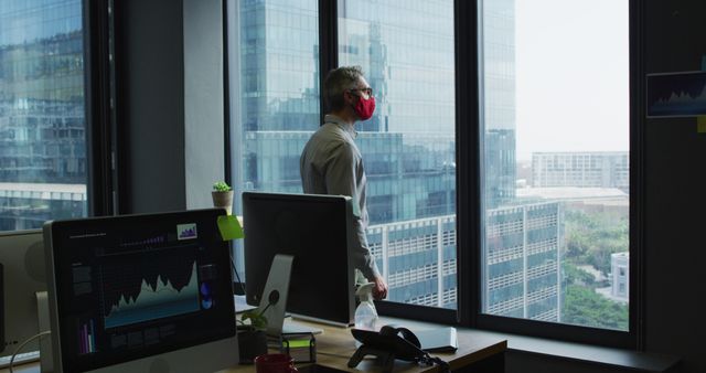 Businessman Wearing Mask Looking Through Office Window During Pandemic - Download Free Stock Images Pikwizard.com