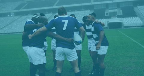 Rugby Team Strategizing Huddle at Stadium