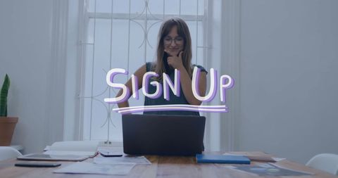 Businesswoman Using Laptop with Overlay Sign-Up Graphic