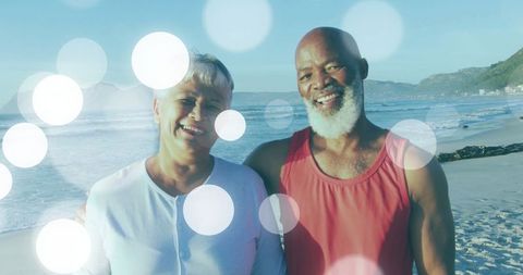 Mature Couple Embracing Joyful Moment on Sunny Beach with Bokeh Light