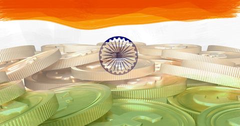 India flag overlay on gold coin stack for economic concept