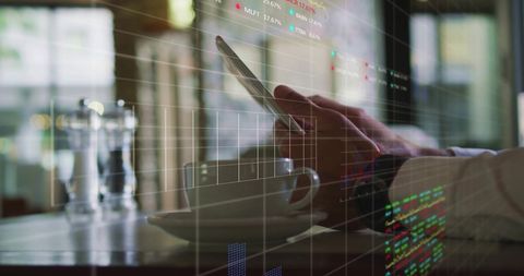 Businessman Analyzing Financial Data Using Smartphone in Cafe