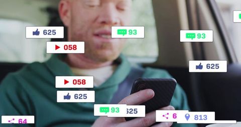 Man interacting with smartphone in car surrounded by social icons