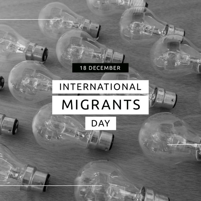 The monochromatic photo features numerous lightbulbs laid on a wooden surface with a text overlay commemorating International Migrants Day on 18 December. Suitable for social media posts, awareness campaigns, and event promotions related to migrant rights and awareness.