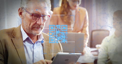 Senior Businessman Using Tablet with QR Code Overlay in Office