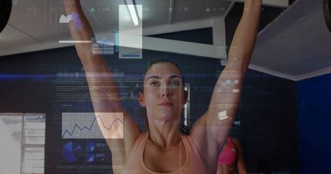 Strong woman lifting with tech data overlay in gym environment