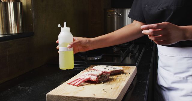 Chef Preparing Seasoned Lamb Rack in Professional Kitchen - Download Free Stock Images Pikwizard.com